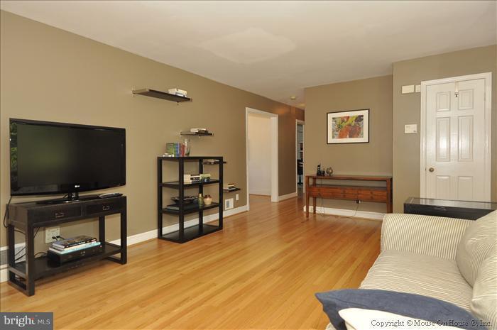 1807 Myrtle Road Silver Spring, MD 20902 - Photo 5 of 27 a living room with furniture and a flat screen tv
