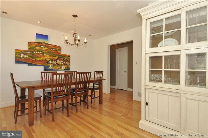 1807 Myrtle Road Silver Spring, MD 20902 - Photo 8 of 27 a view of a dining room with furniture window and wooden floor