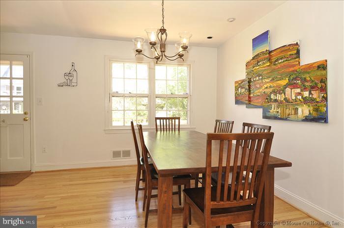 1807 Myrtle Road Silver Spring, MD 20902 - Photo 10 of 27 a view of a dining room with furniture window and wooden floor