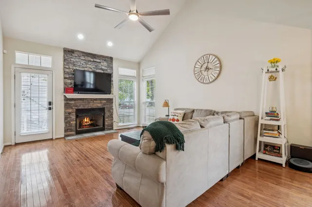 a living room with furniture and a fireplace
