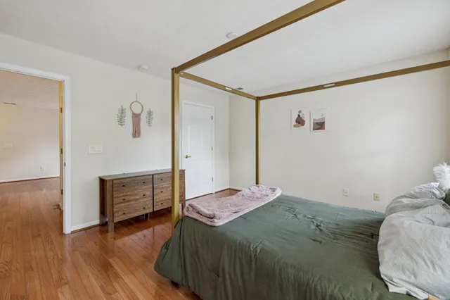 a bedroom with a bed and a dresser