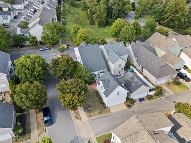 an aerial view of a city with lots of residential buildings