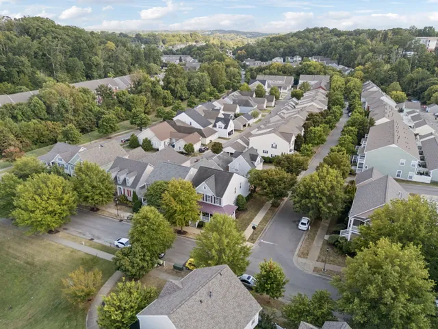 an aerial view of a house with a garden