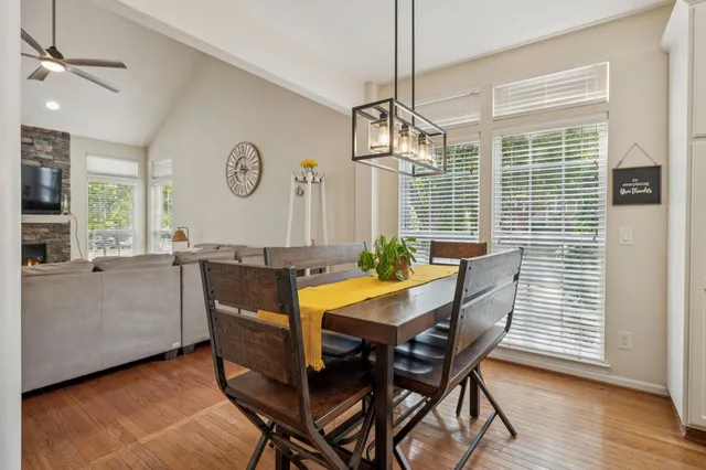 a dining room with furniture and window