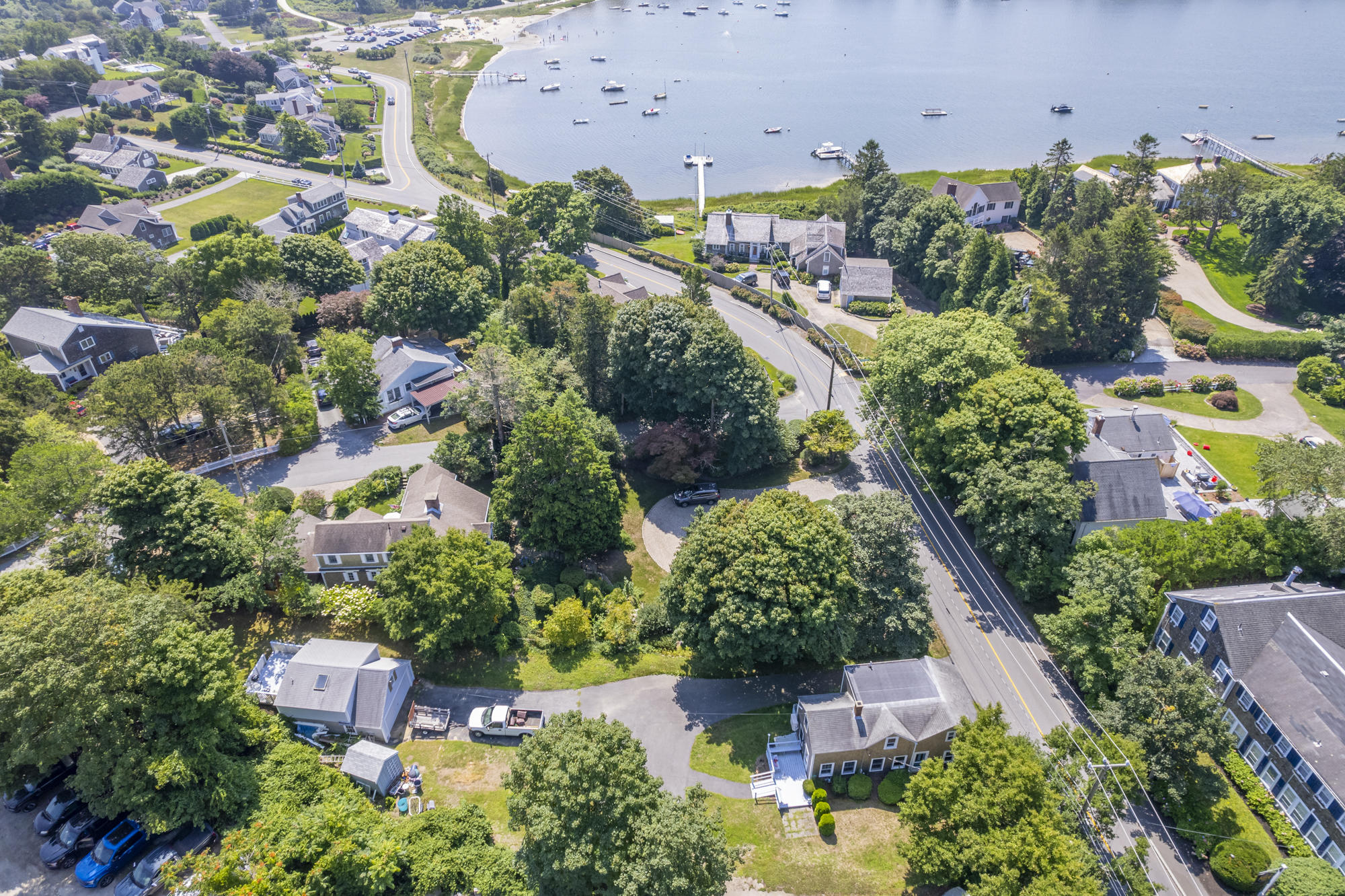 77 Queen Anne Road Chatham, MA 02633 - Photo 3 of 28 an aerial view of a city