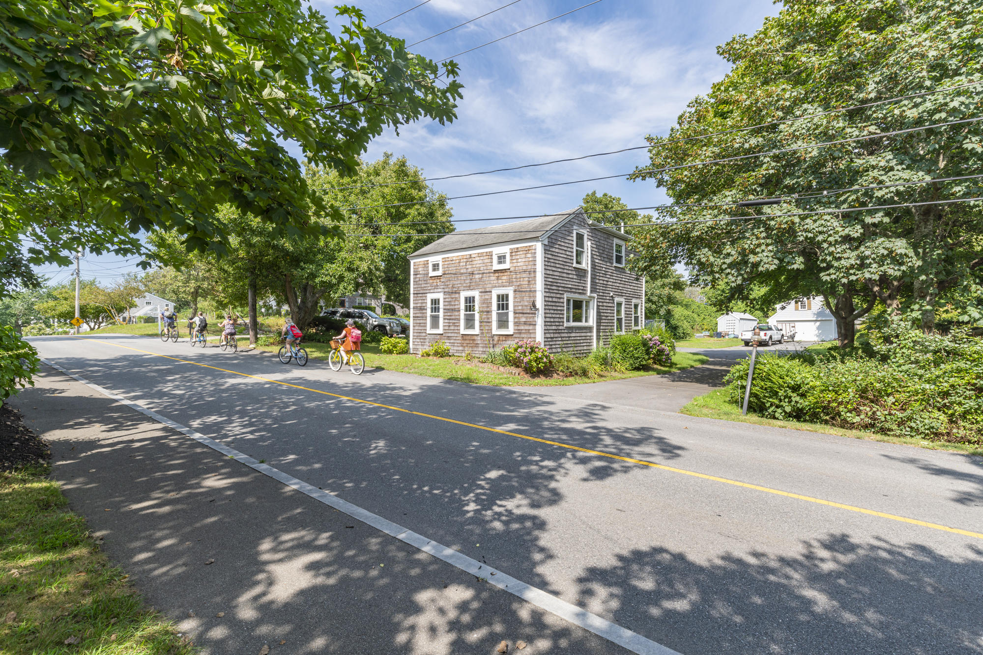 77 Queen Anne Road Chatham, MA 02633 - Photo 6 of 28 a view of road with large trees