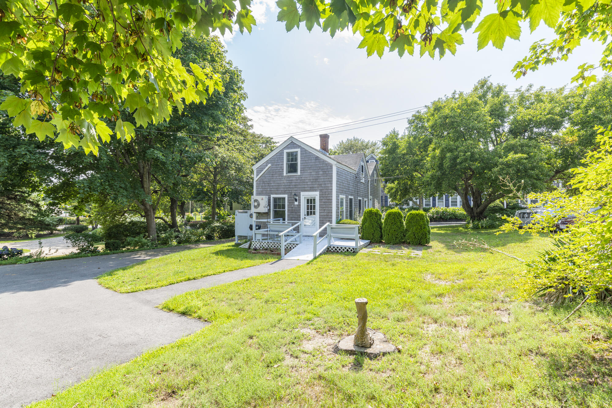 77 Queen Anne Road Chatham, MA 02633 - Photo 10 of 28 a view of a house with swimming pool and sitting area