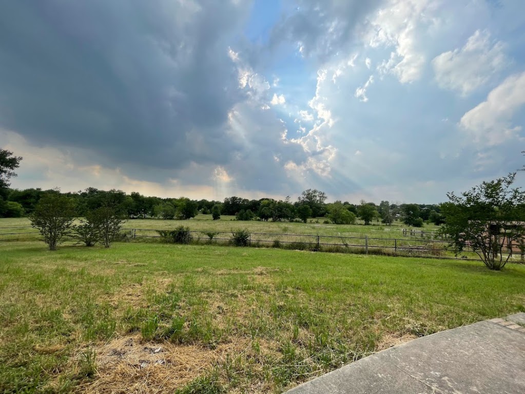 5001 Blue Bluff Road Austin, TX 78724 - Photo 2 of 28 a view of a golf course with a lake