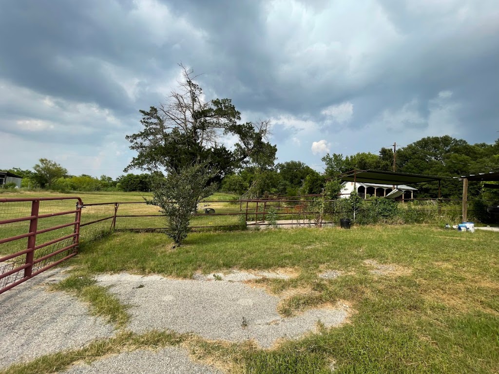 5001 Blue Bluff Road Austin, TX 78724 - Photo 5 of 28 a front view of a house with garden
