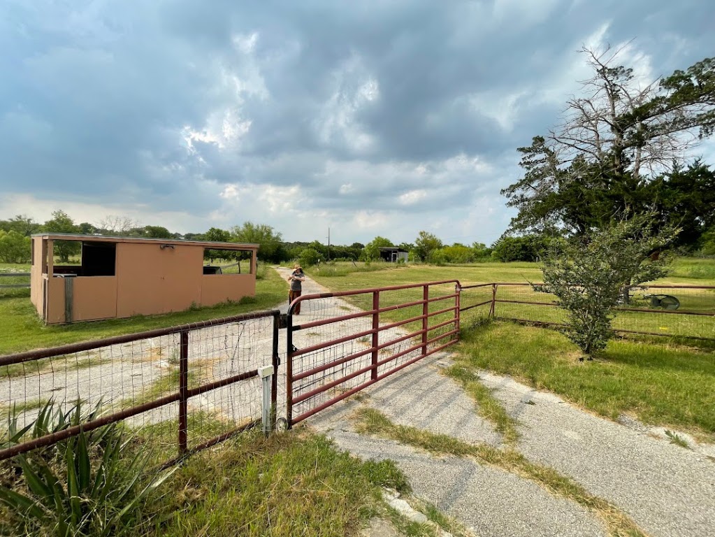 5001 Blue Bluff Road Austin, TX 78724 - Photo 6 of 28 a view of a pathway with a wrought fence