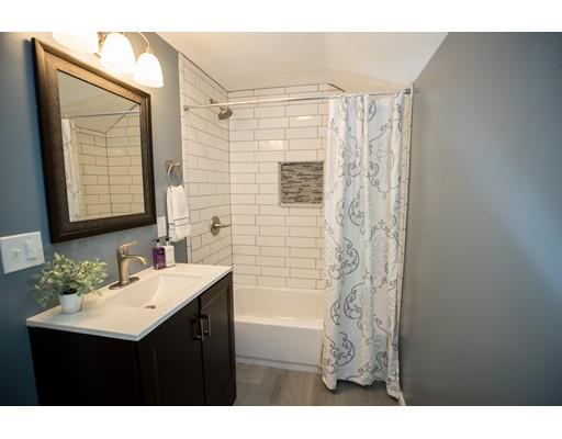 1350 Plumtree Road Springfield, MA 01119 - Photo 9 of 11 a bathroom with a sink vanity granite tub shower and a mirror