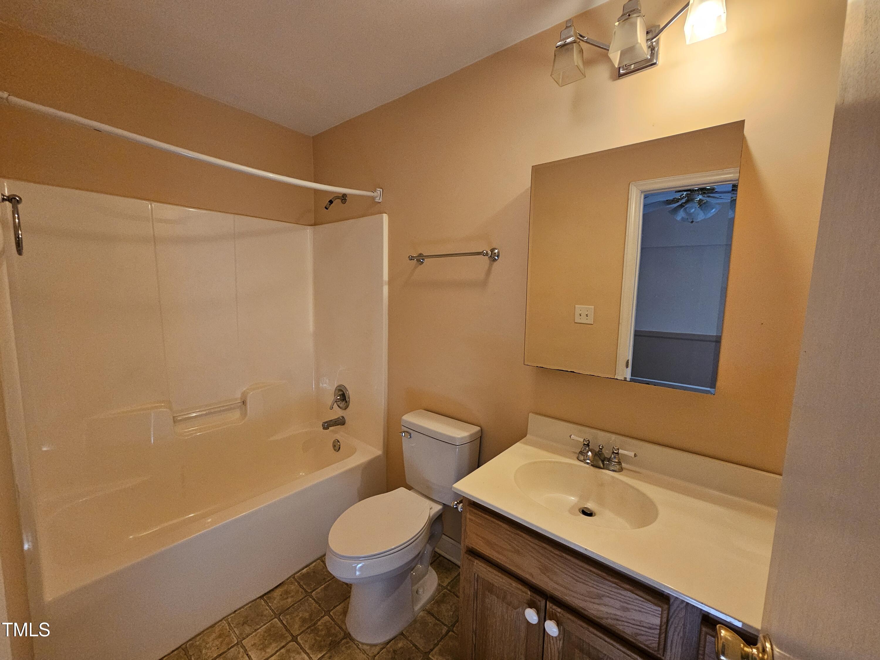 8178 Highway 751 Durham, NC 27713 - Photo 16 of 20 a bathroom with a sink a toilet and shower