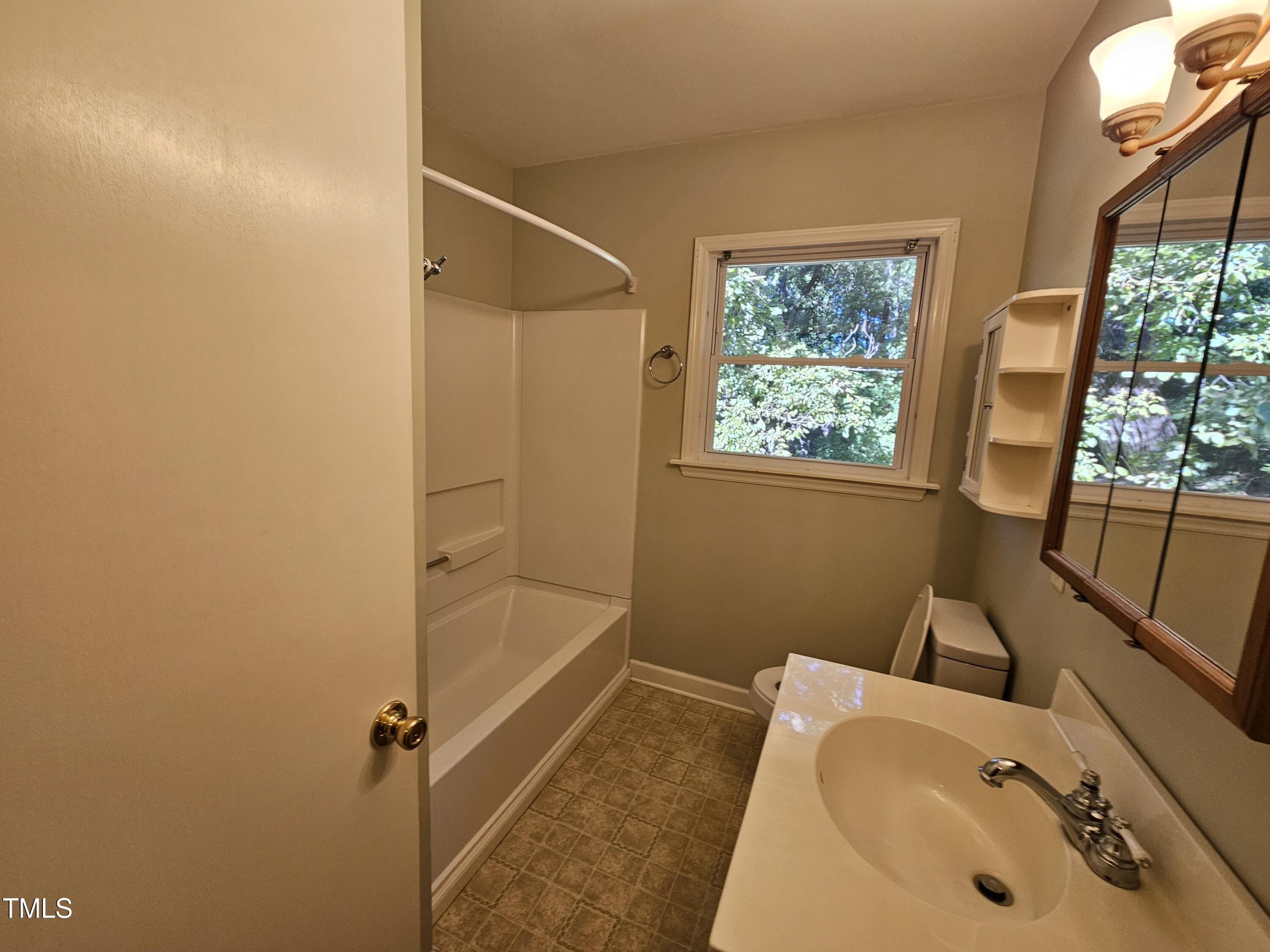 8178 Highway 751 Durham, NC 27713 - Photo 17 of 20 a bathroom with a sink and a tub