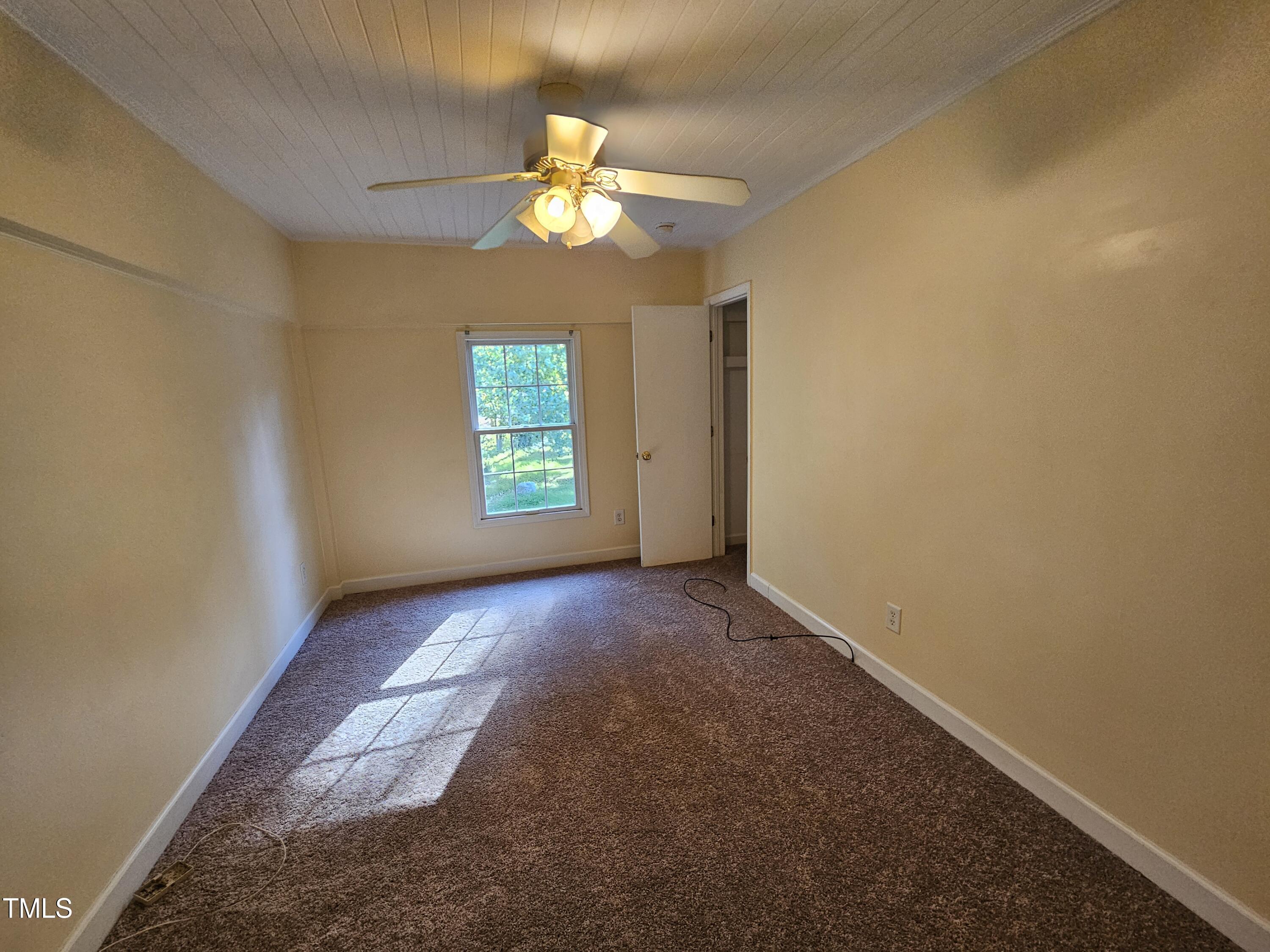 8178 Highway 751 Durham, NC 27713 - Photo 19 of 20 a view of an empty room with a window