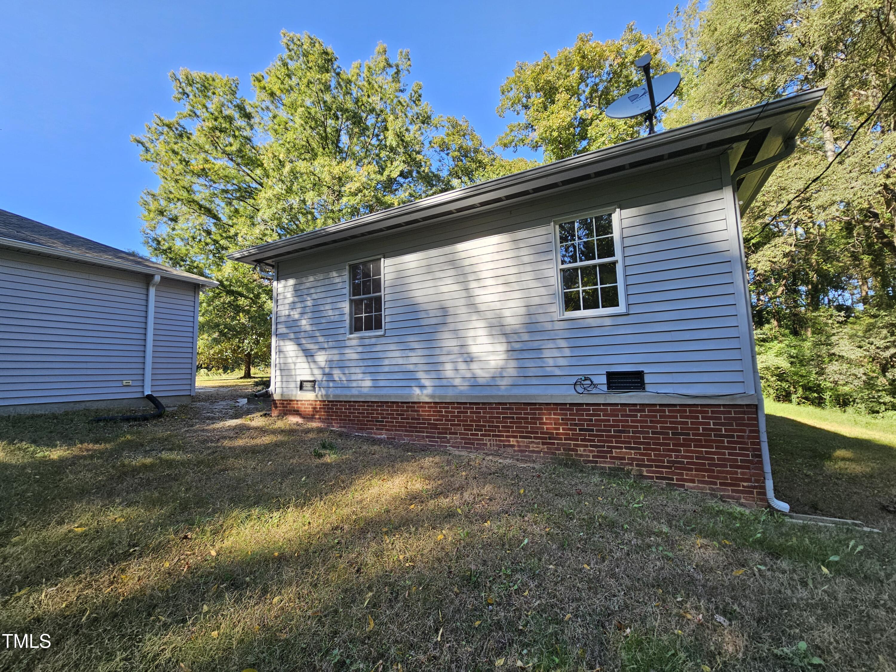 8178 Highway 751 Durham, NC 27713 - Photo 6 of 20 a backyard of a house with lots of green space