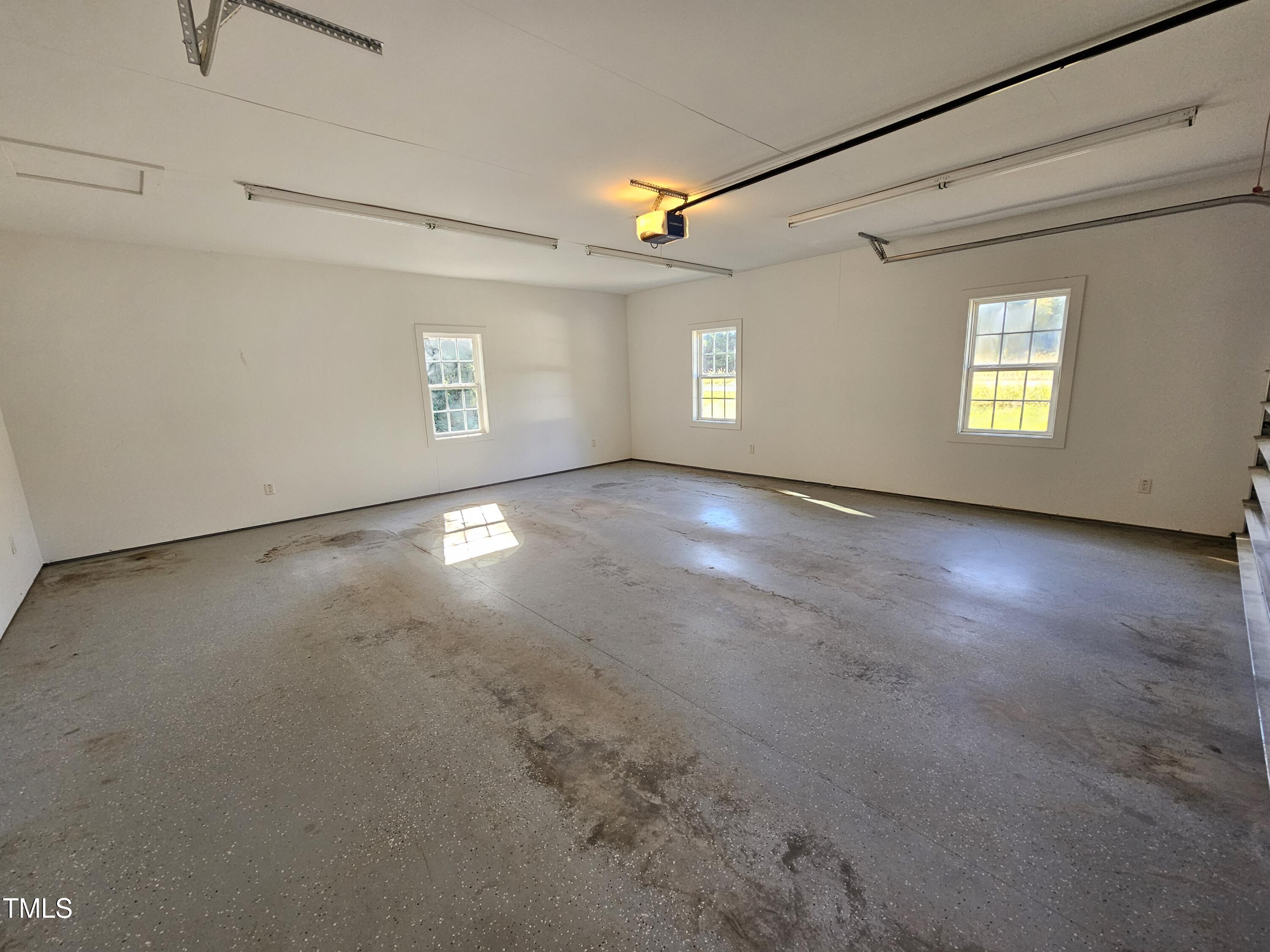 8178 Highway 751 Durham, NC 27713 - Photo 8 of 20 an empty room with windows and entrance