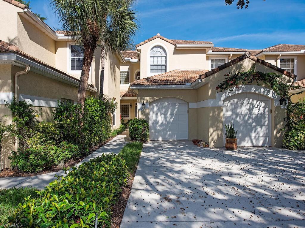 65 Silver Oaks Circle, Unit 11202 Naples, FL 34119 - Photo 4 of 12 a view of a house with a patio