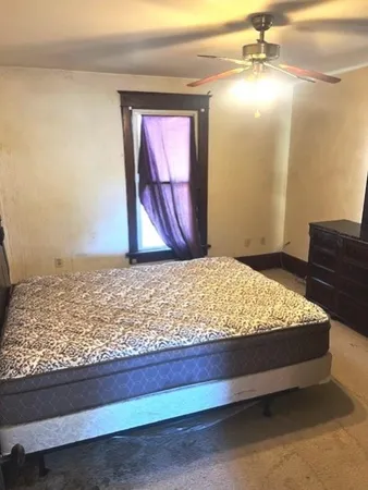 a bedroom with a bed