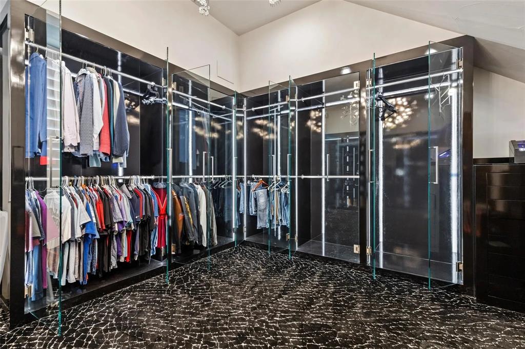 935 West Dove Road Southlake, TX 76092 - Photo 21 of 39 a view of walk in closet with clothes
