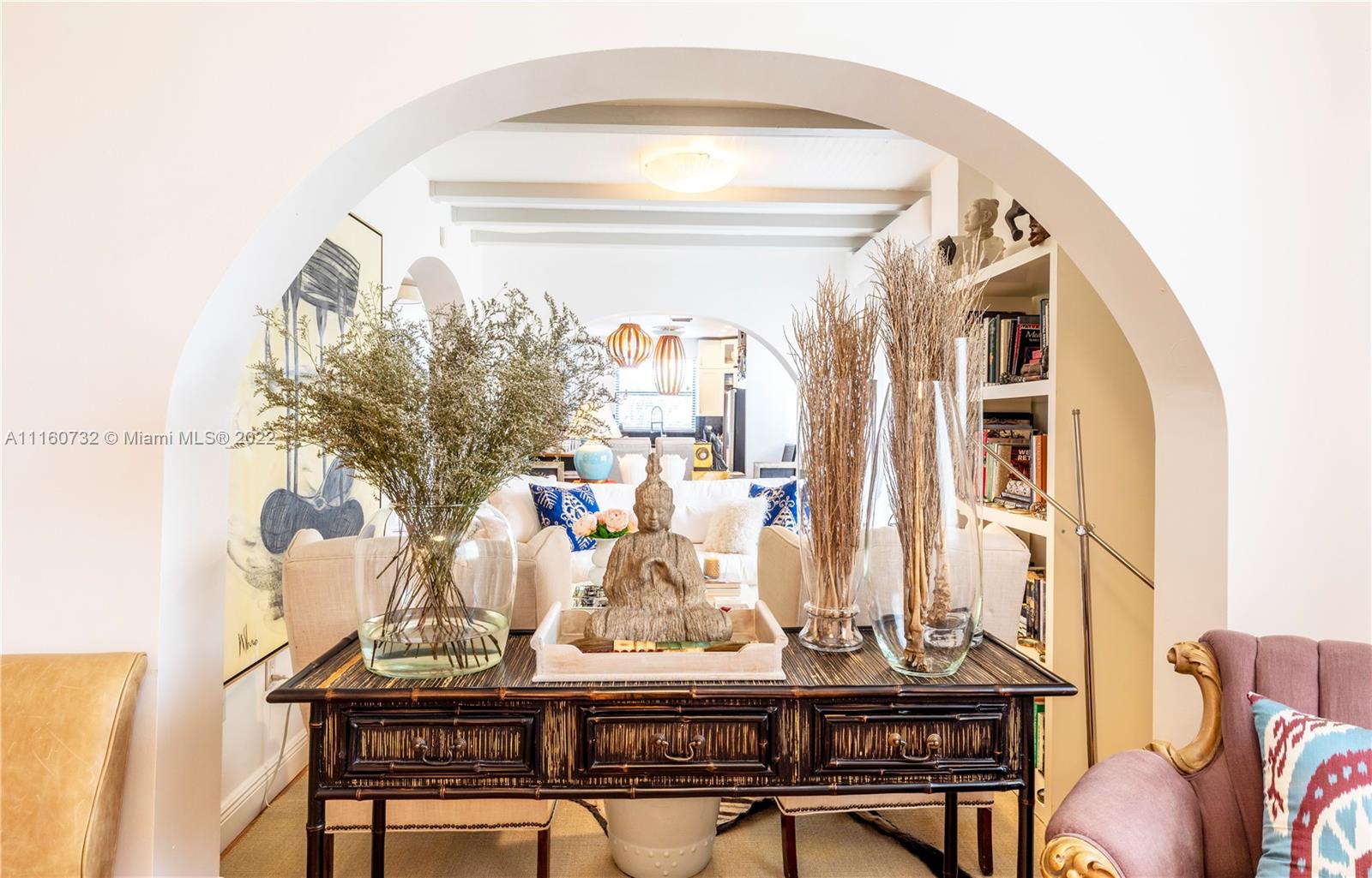 4216 Alton Road Miami Beach, FL 33140 - Photo 1 of 27 a view of a dining room with furniture and a chandelier