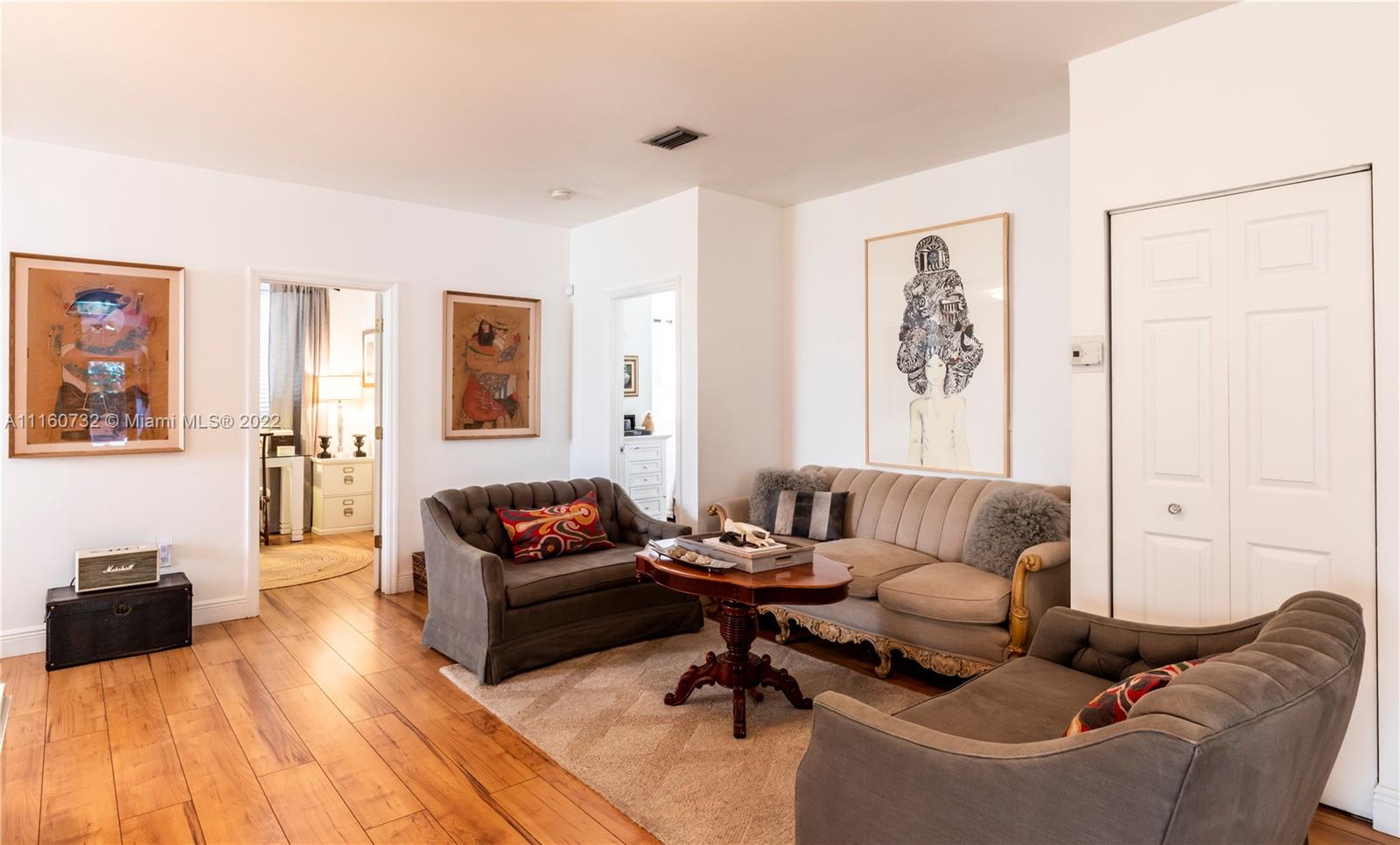 4216 Alton Road Miami Beach, FL 33140 - Photo 18 of 27 a living room with furniture and a hard wood floor
