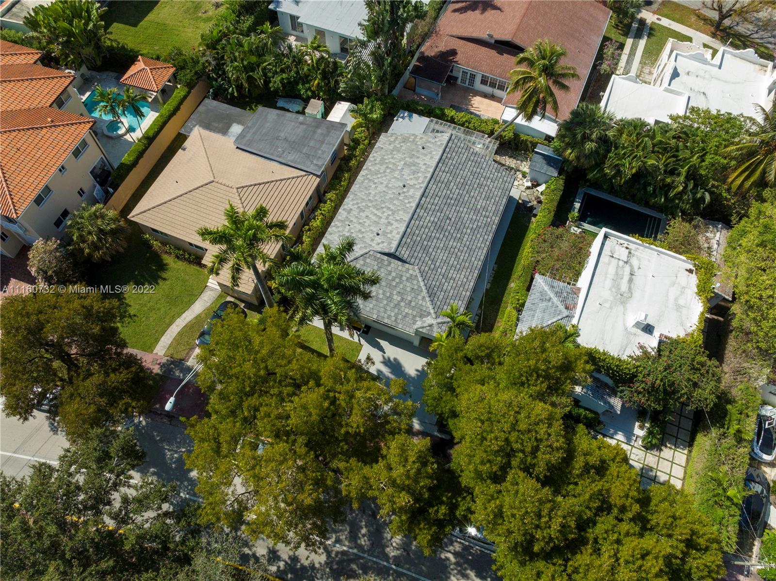4216 Alton Road Miami Beach, FL 33140 - Photo 23 of 27 an aerial view of a house with a yard and a garden