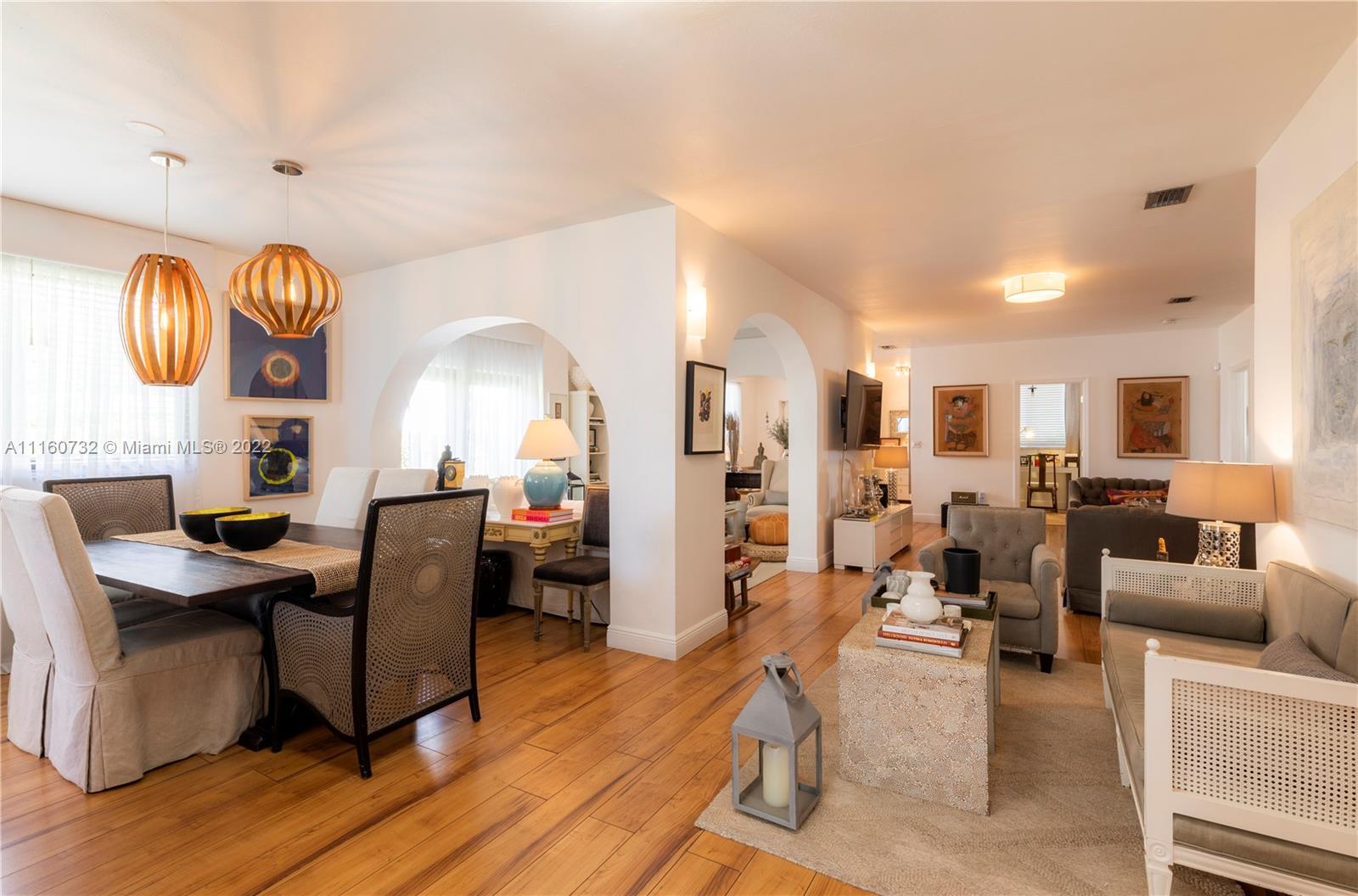 4216 Alton Road Miami Beach, FL 33140 - Photo 6 of 27 a view of a livingroom with furniture wooden floor and a rug