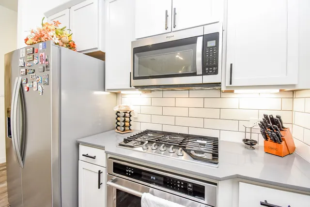 a kitchen with a stove and a microwave