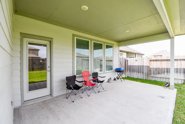 a view of a swimming pool with a lounge chair