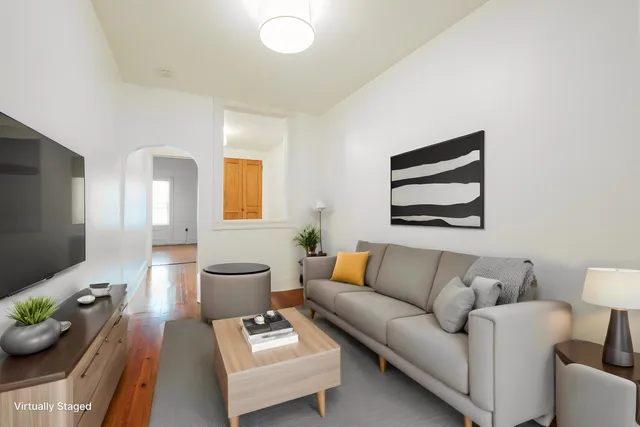 a living room with furniture and a couch