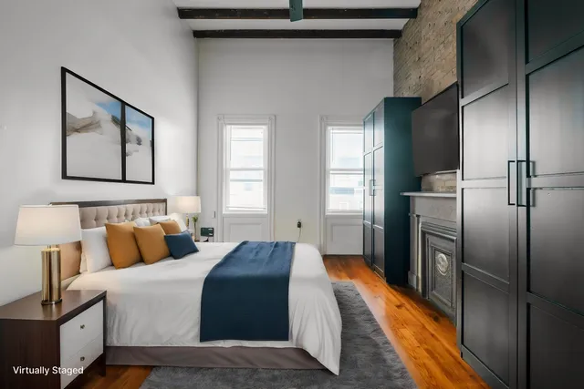 a bedroom with bed and window