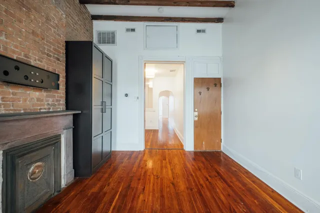 a view of a livingroom with wooden floor