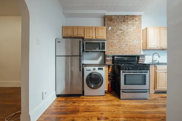 a kitchen with a stove and a refrigerator