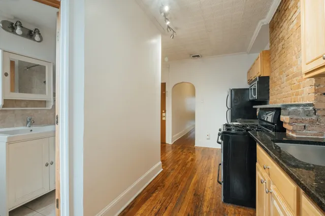 a kitchen with a refrigerator stove and a sink