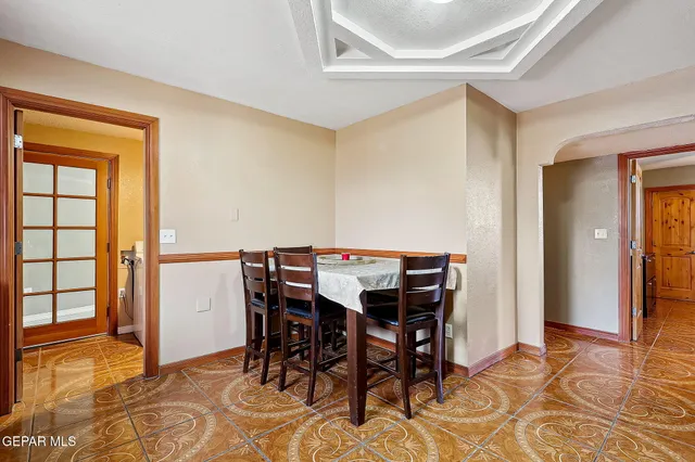 a kitchen with granite countertop stainless steel appliances a stove sink and cabinets