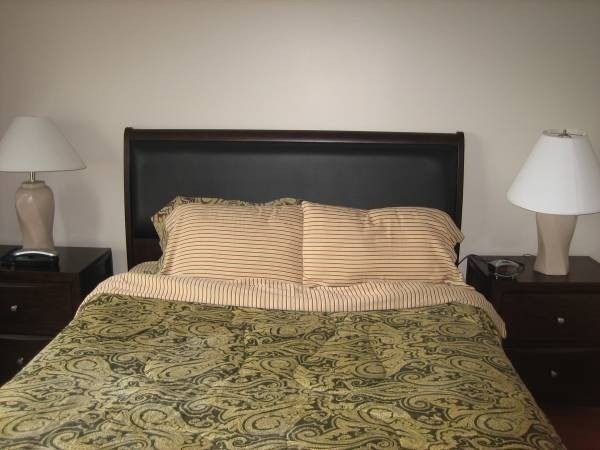 36 Gordon Street Boston, MA 02134 - Photo 11 of 14 a bedroom with a bed and a lamp