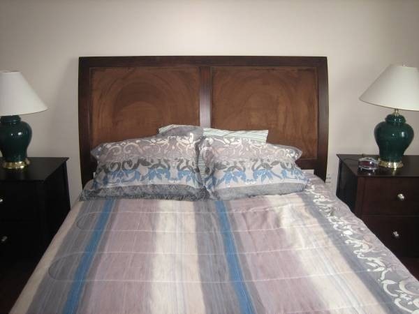 36 Gordon Street Boston, MA 02134 - Photo 10 of 14 a bedroom with a bed and a mirror