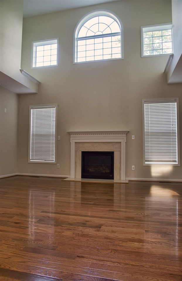 1017 Bianco Drive Raleigh, NC 27607 - Photo 7 of 13 Two story family room with lots of windows for natural light