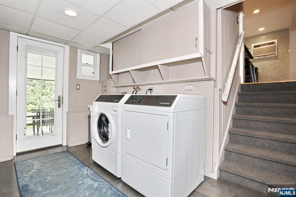 87 Barbara Road Dumont, NJ 07628 - Photo 32 of 48 a utility room with dryer washer and a window