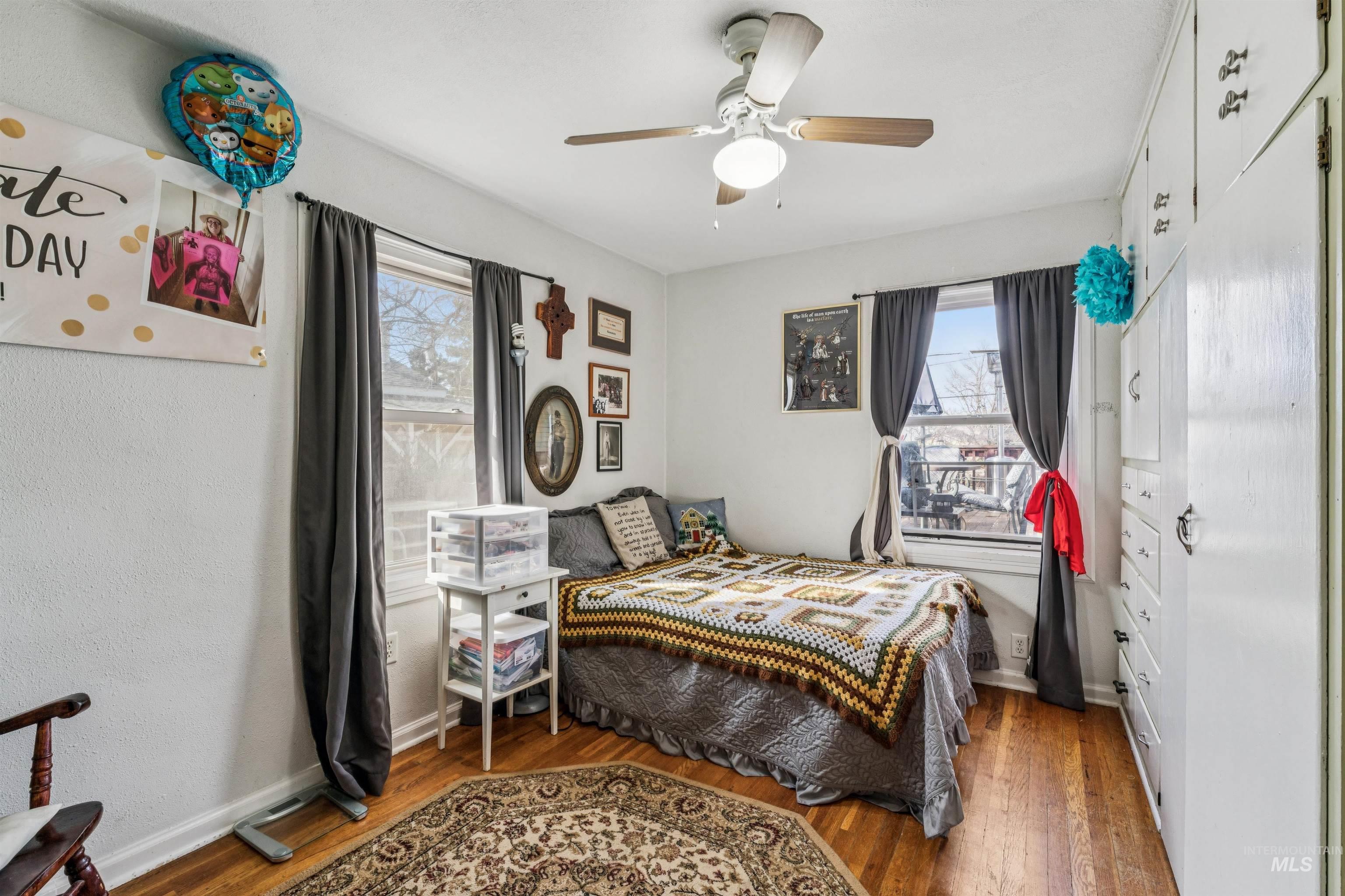 124 Halstead Street Caldwell, ID 83605 - Photo 11 of 42 Bedroom with wood-type flooring and ceiling fan