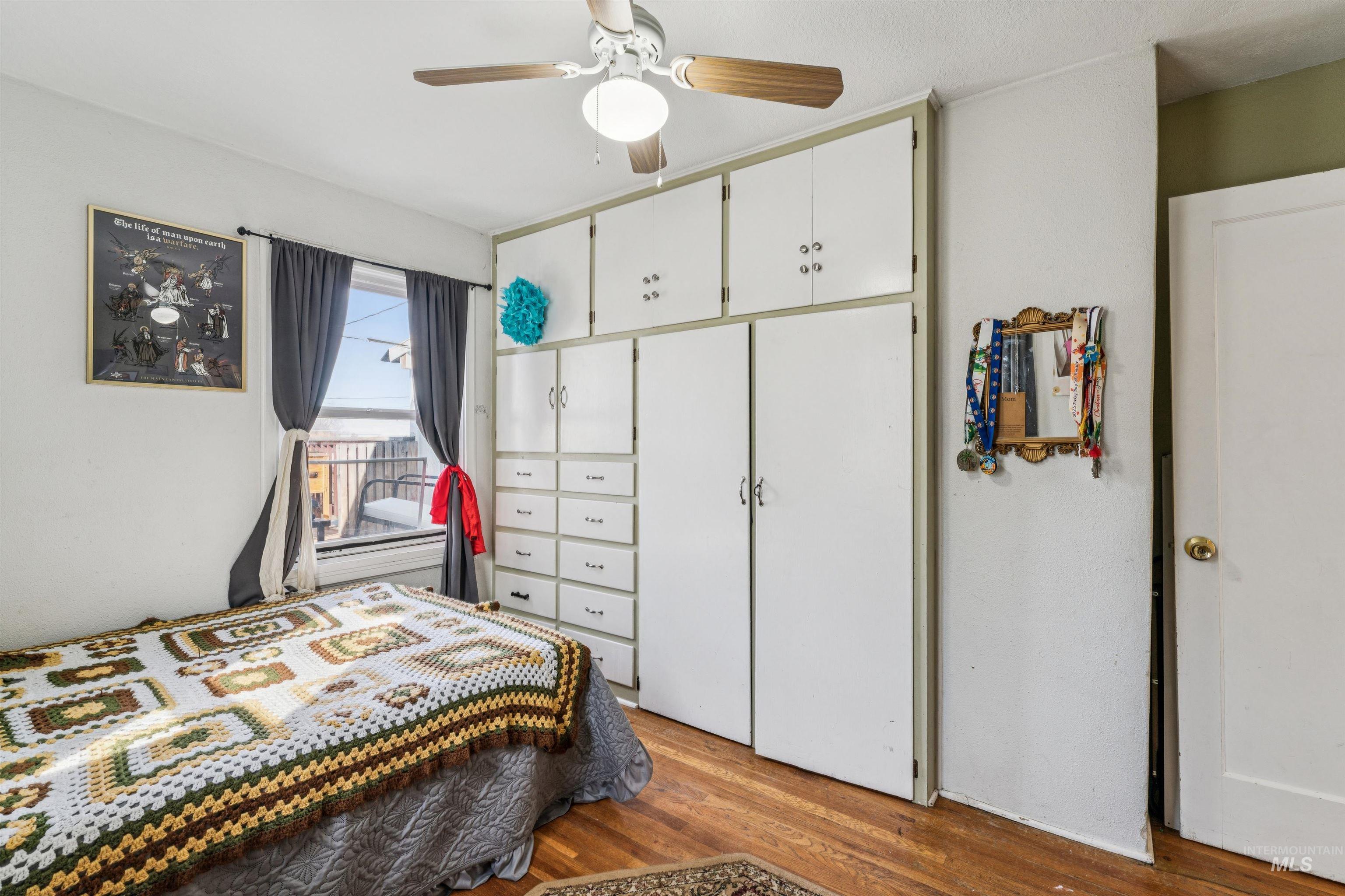 124 Halstead Street Caldwell, ID 83605 - Photo 13 of 42 Bedroom with light wood-style floors, ceiling fan, and a closet
