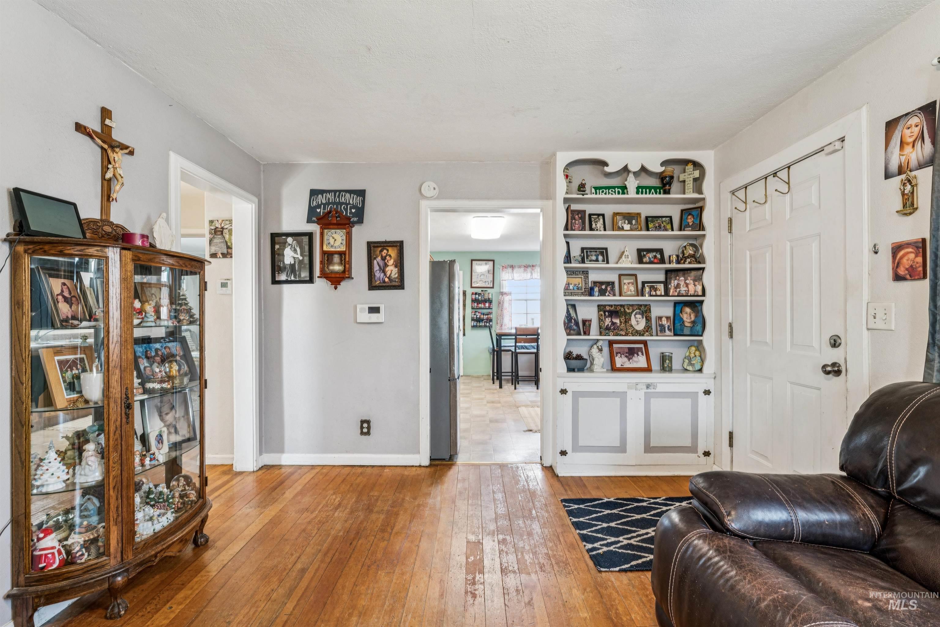 124 Halstead Street Caldwell, ID 83605 - Photo 15 of 42 Living area with light wood-style floors and baseboards