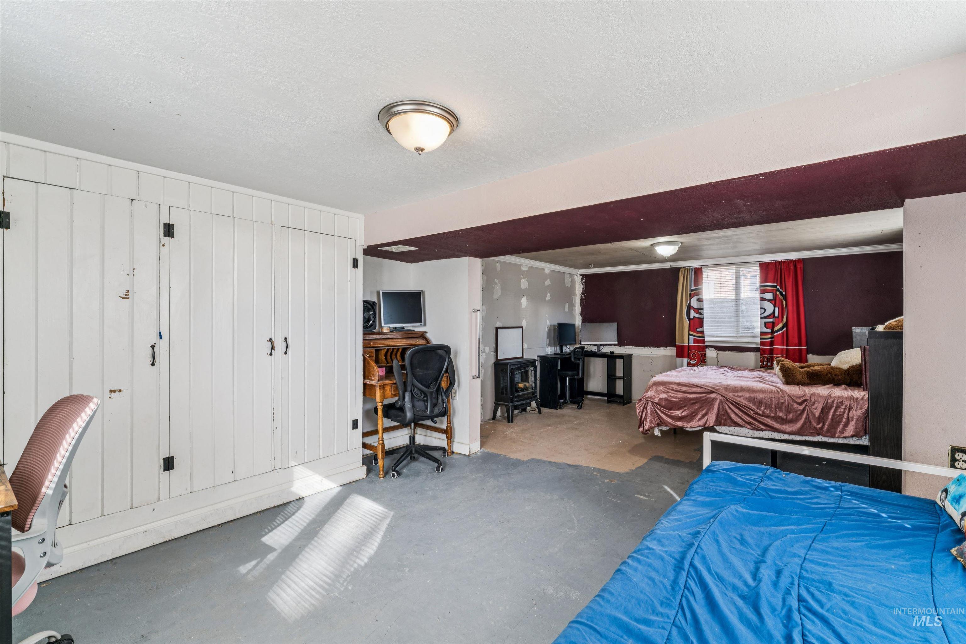 124 Halstead Street Caldwell, ID 83605 - Photo 28 of 42 Bedroom with an office area and concrete flooring