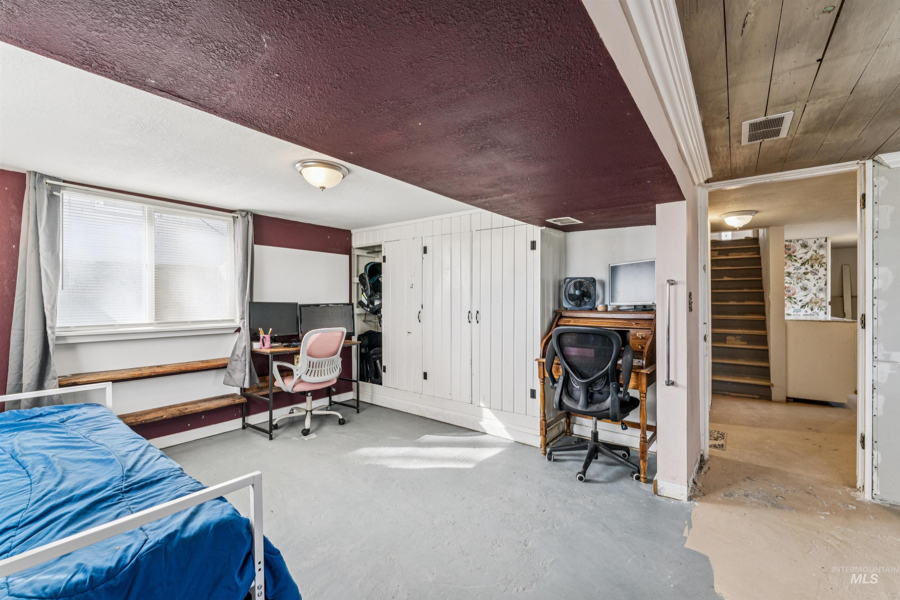 124 Halstead Street Caldwell, ID 83605 - Photo 29 of 42 Bedroom with a desk and concrete flooring