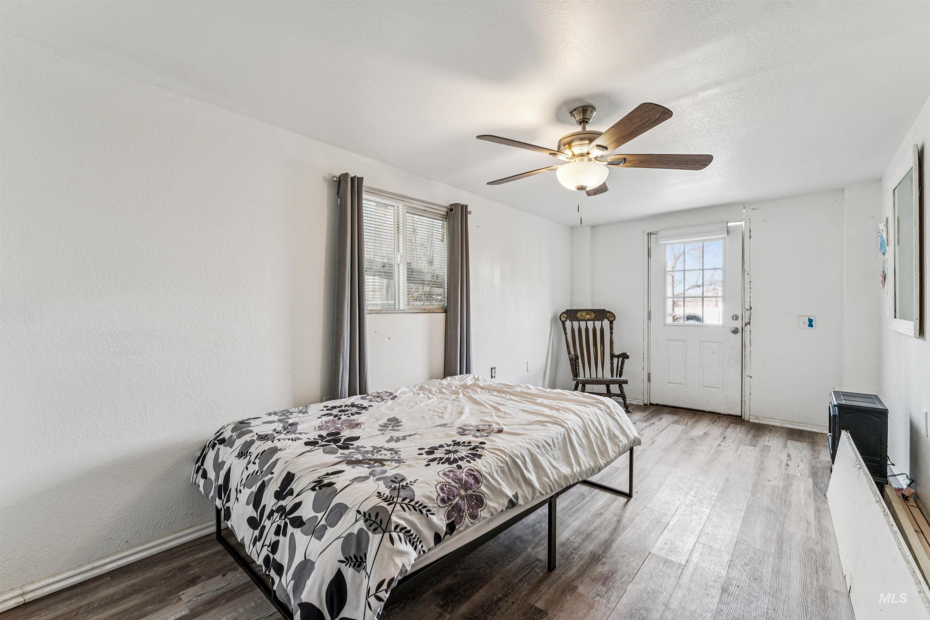 124 Halstead Street Caldwell, ID 83605 - Photo 35 of 42 Bedroom with wood finished floors and ceiling fan