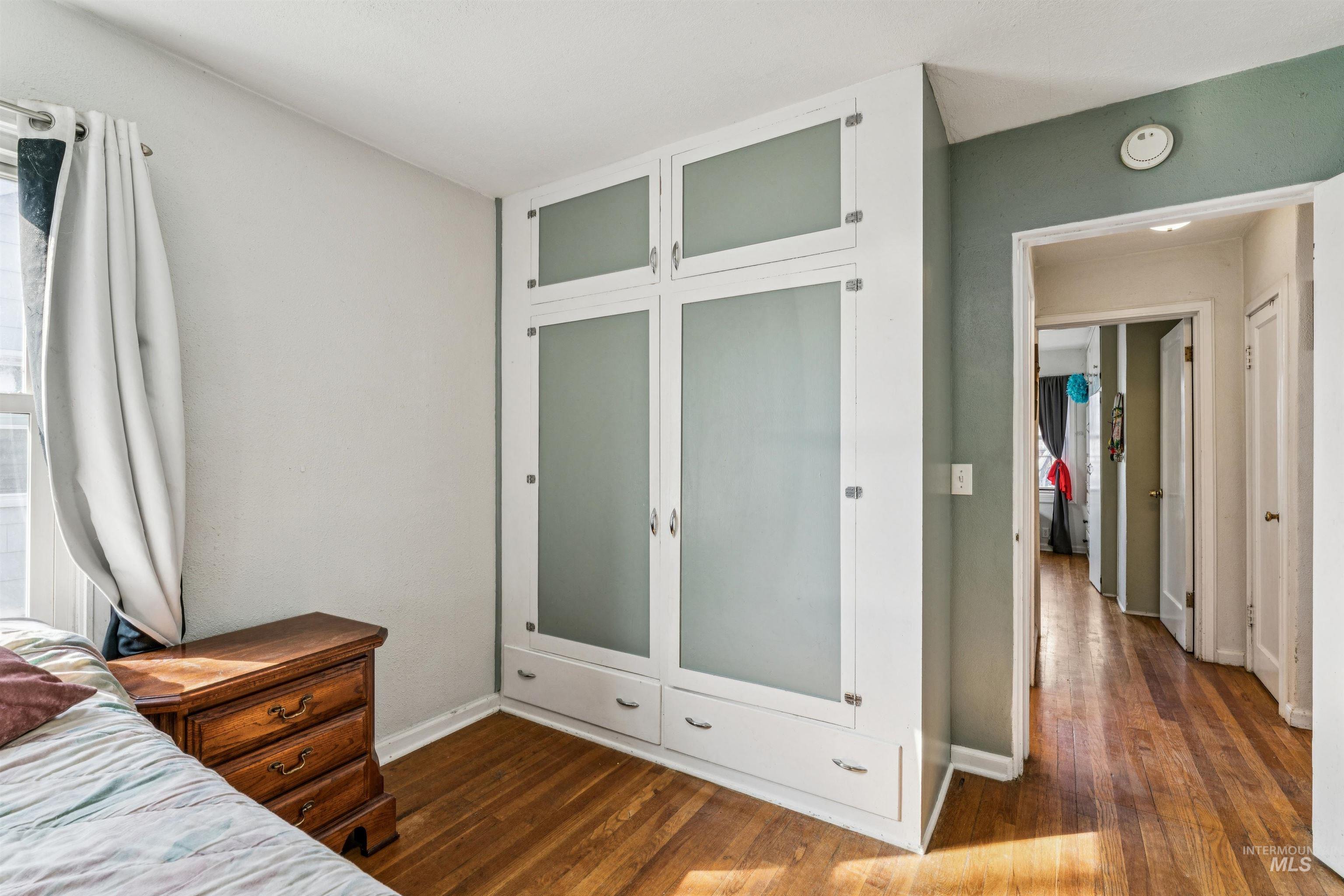 124 Halstead Street Caldwell, ID 83605 - Photo 10 of 42 Bedroom featuring a closet and dark wood-style flooring