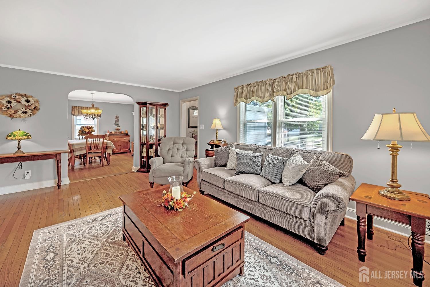 446 2nd Street Dunellen, NJ 08812 - Photo 11 of 31 a living room with furniture a table and a window