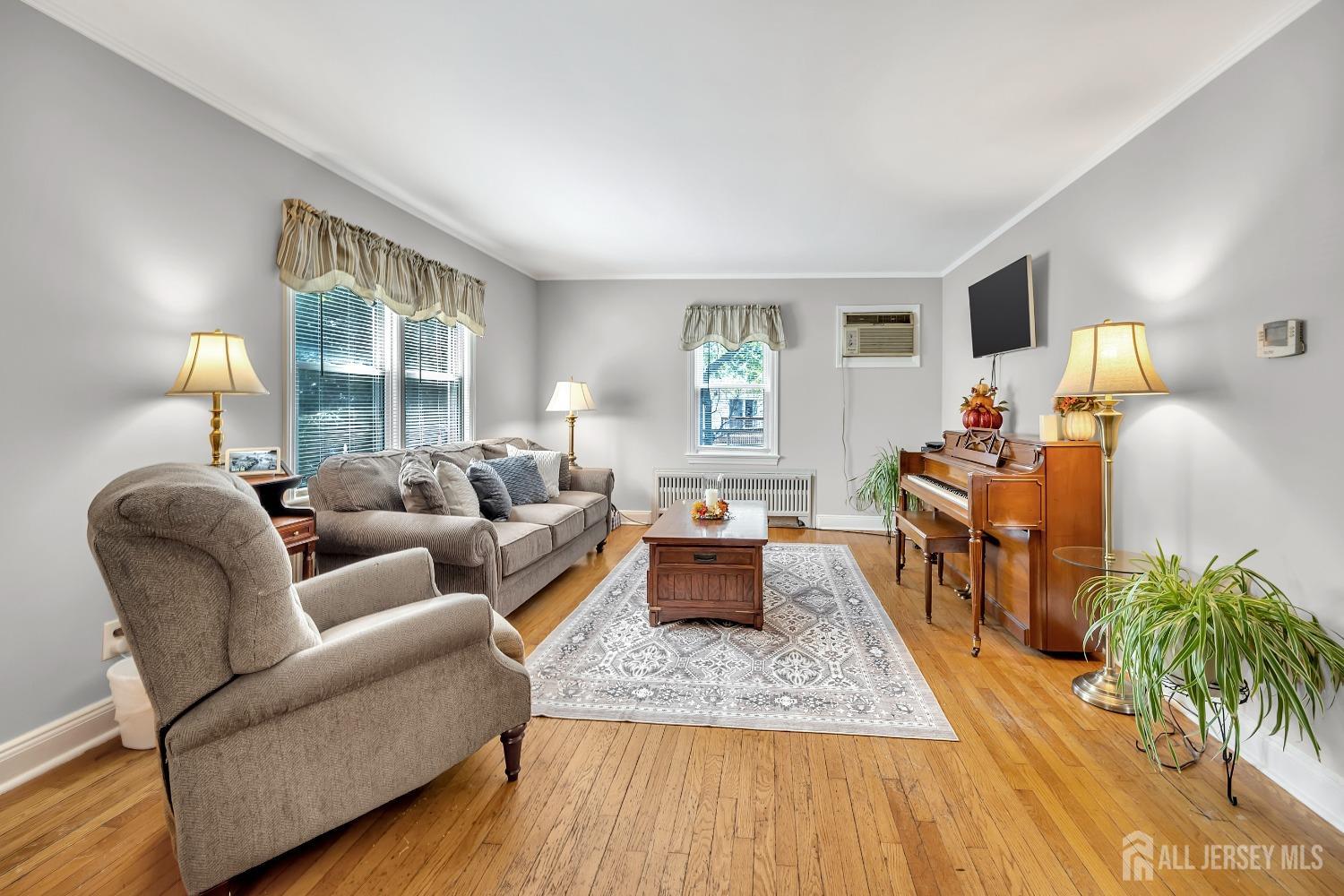 446 2nd Street Dunellen, NJ 08812 - Photo 12 of 31 a living room with furniture and a wooden floor