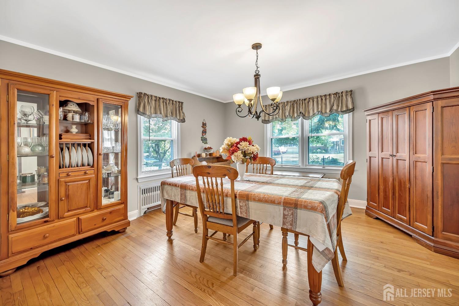 446 2nd Street Dunellen, NJ 08812 - Photo 13 of 31 a view of a dining room with furniture wooden floor and chandelier