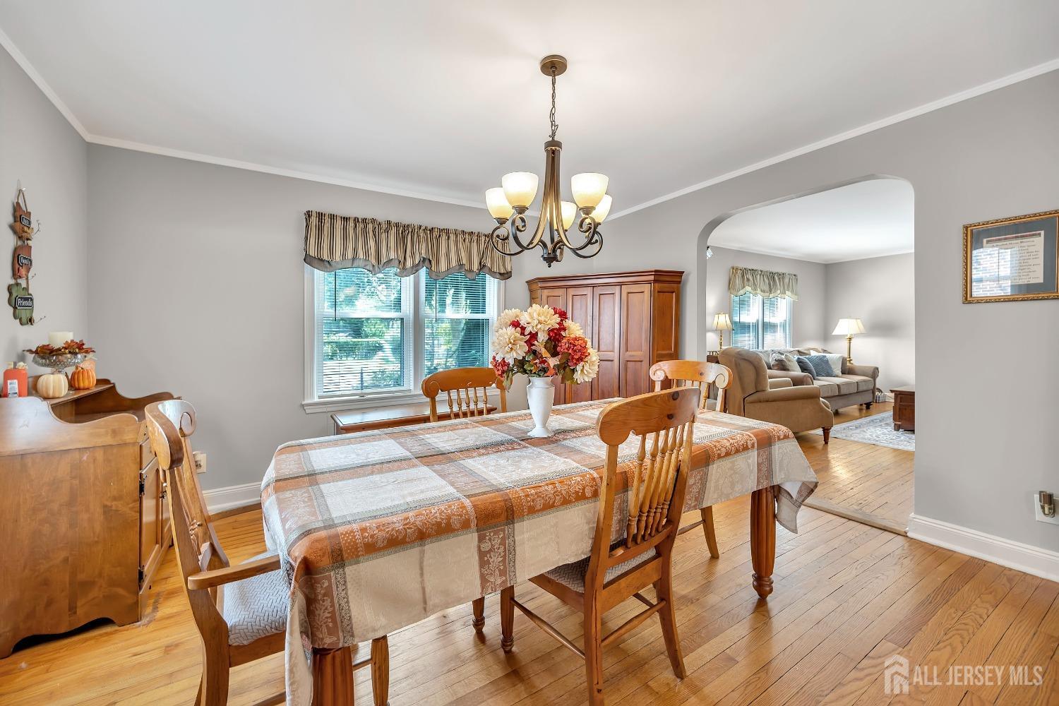 446 2nd Street Dunellen, NJ 08812 - Photo 14 of 31 a dining room with furniture a chandelier and wooden floor